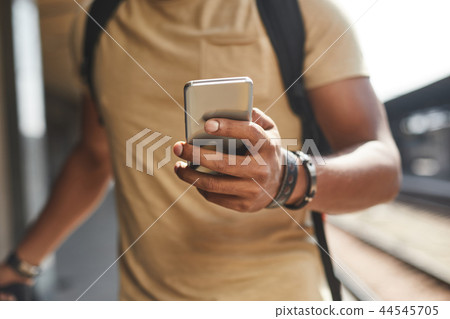 Selective focus of male hands with a smartphone 44545705