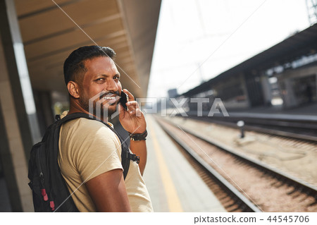 Cheerful hindu man talking on his phone 44545706