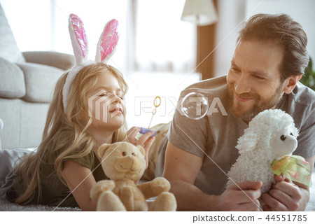 Carefree girl having fun with her daddy at home 44551785