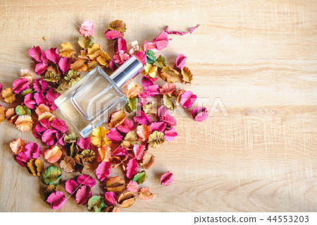 Perfume bottle with flower Perfume bottle with flower 44553203
