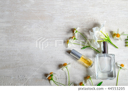 Perfume bottle with flower 44553205