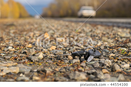A bunch of keys lying on the side of the road A bunch of keys lying on the side of the road 44554100
