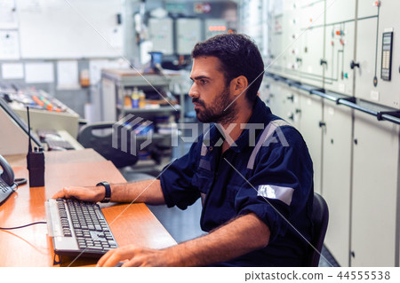 Marine engineer officer working in engine room 44555538