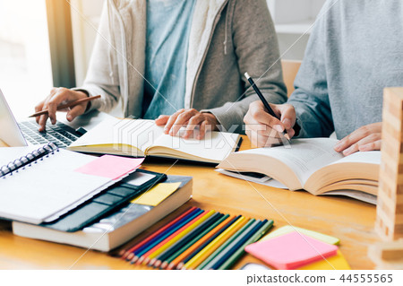 Teenager studying at desk and doing homeworks 44555565