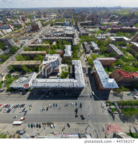 Aerial city view with crossroads and roads, houses buildings. Copter shot. Panoramic image. Aerial city view with crossroads and roads, houses buildings. Copter shot. Panoramic image. 44556257