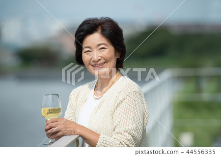 Senior woman wine lifestyle image 44556335