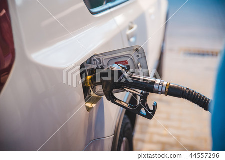 fueling up the car 44557296