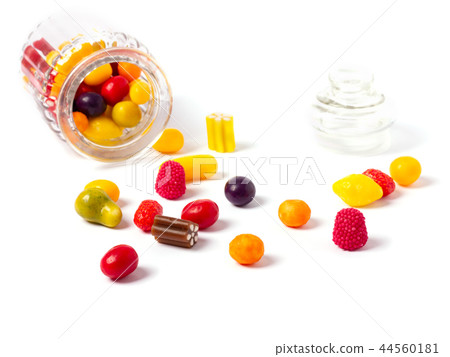 Glass candy jar filled with colorful candies. Glass candy jar filled with colorful candies. 44560181