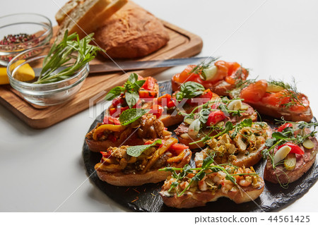 Set of assorted bruschetta with various toppings for holiday. Top view. Party food concept. 44561425