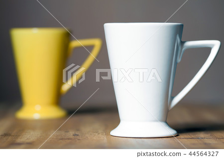 White mug on the desktop White mug on the desktop 44564327