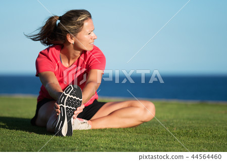 Sport woman doing stretching fitness exercise 44564460