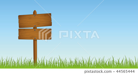 wooden sign in grass with copy space for your message 44565444