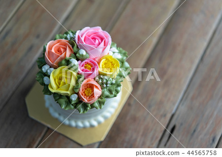 Cake cream is sweet dessert on wooden table Cake cream is sweet dessert on wooden table 44565758