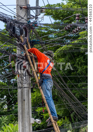 Working to install electric line Working to install electric line 44566310
