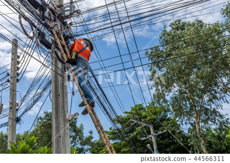 Working to install electric line 44566311