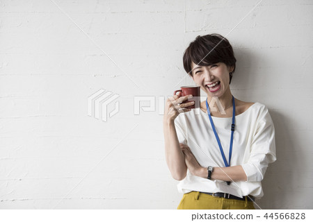 A woman drinking coffee A woman drinking coffee 44566828