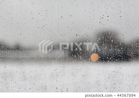 Water drops on a window with a black and white background 44567894