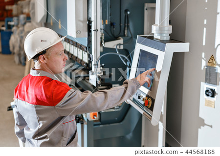 control computer display of Machine. Manufacture workers adjusts the machine in the warehouse. the control computer display of Machine. Manufacture workers adjusts the machine in the warehouse. the 44568188