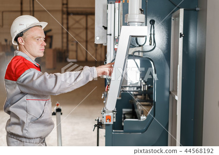 control computer display of Machine. Manufacture workers adjusts the machine in the warehouse. the control computer display of Machine. Manufacture workers adjusts the machine in the warehouse. the 44568192