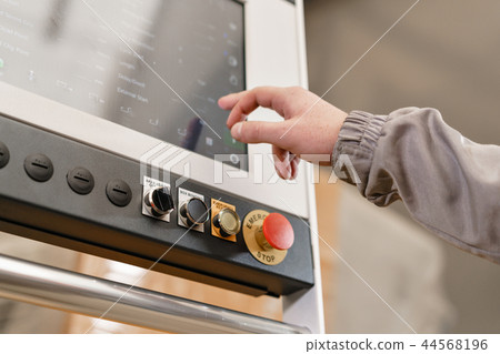 control computer display of Machine. Manufacture workers adjusts the machine in the warehouse. the control computer display of Machine. Manufacture workers adjusts the machine in the warehouse. the 44568196