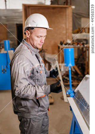 metal corner of zinced. Tool and bending equipment for sheet metal. manufacture workshop. the metal corner of zinced. Tool and bending equipment for sheet metal. manufacture workshop. the 44568339