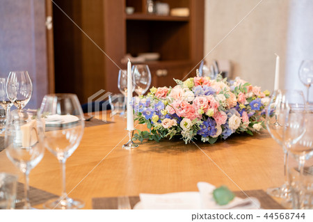 beautiful flower arrangement. Wedding Banquet or gala dinner. The chairs and table for guests beautiful flower arrangement. Wedding Banquet or gala dinner. The chairs and table for guests 44568744