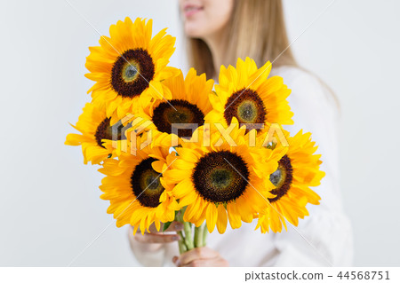 Bouquet of yellow sunflowers , flower in woman hand. Room morning. Colors of autumn and mood fall 44568751