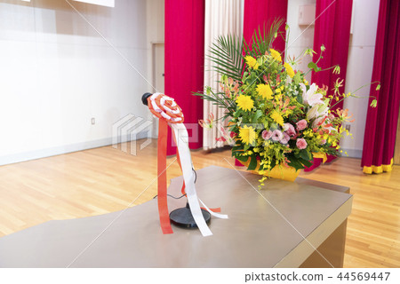 A podium on the stage (Mike & flowers on stage) 44569447