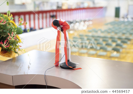 A podium on the stage (Mike & flowers on stage) A podium on the stage (Mike & flowers on stage) 44569457