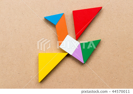 Color tangram puzzle in flying bird shape Color tangram puzzle in flying bird shape 44570011