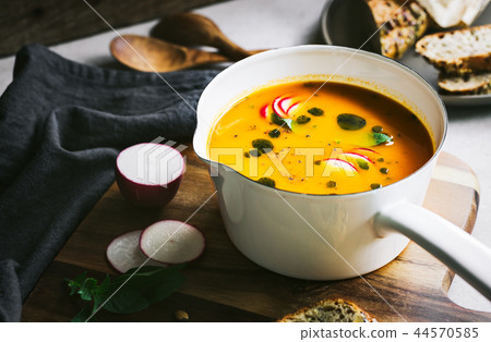Carrot and Pumpkin soup with Basil oil 44570585