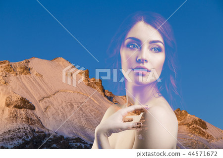 Double exposure portrait of young beautiful woman and mountains. 44571672