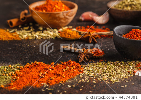 Different kind of spices on dark background. Different kind of spices on dark background. 44574391