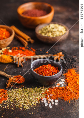 Different kind of spices on dark background. 44574394