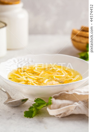 Homemade chicken noodle soup in a white plate Homemade chicken noodle soup in a white plate 44574452