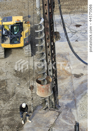 Dismantling work site Workers and augers during piling work 44575066