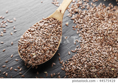 flax seeds on a black background flax seeds on a black background 44575419