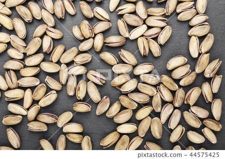 pistachios scattered as background pistachios scattered as background 44575425