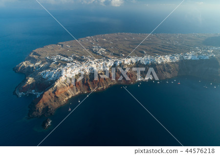 Aerial view flying over city of Oia on Santorini Greece Aerial view flying over city of Oia on Santorini Greece 44576218