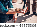 Chipmunk takes feed from the hand, Agra, India 44576306