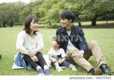 Family image Parents and children playing in the park 44577401