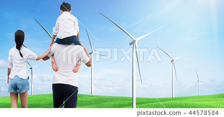Mother and father carrying son on his shoulders. 44578584