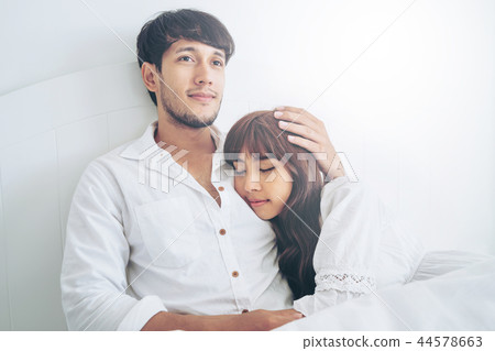 Happy young couple relaxing in the home bedroom. 44578663