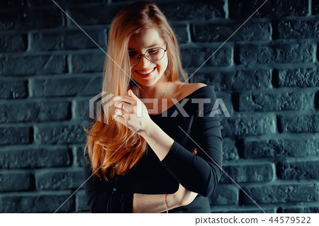 red-haired happy girl wearing glasses / business woman concept, confident, successful girl with glasses. Sight, training, European business. 44579522