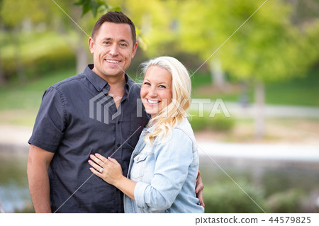Young Caucasian Couple Portrait In The Park Young Caucasian Couple Portrait In The Park 44579825