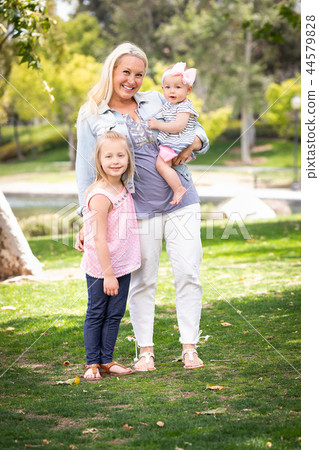 Caucasian Mommy and Daughters Portrait In The Park Caucasian Mommy and Daughters Portrait In The Park 44579828