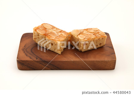 Apple Almond Pound Cake on a Cutting Board White Background Apple Almond Pound Cake on a Cutting Board White Background 44580043