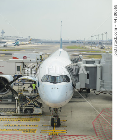 Commercial airplane ready for boarding in Singapor 44580669