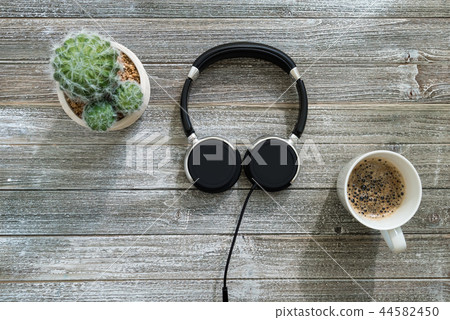 Headphones on a wooden desk 44582450