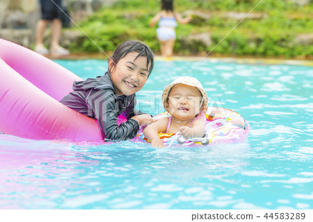 Children playing in the pool Children playing in the pool 44583289